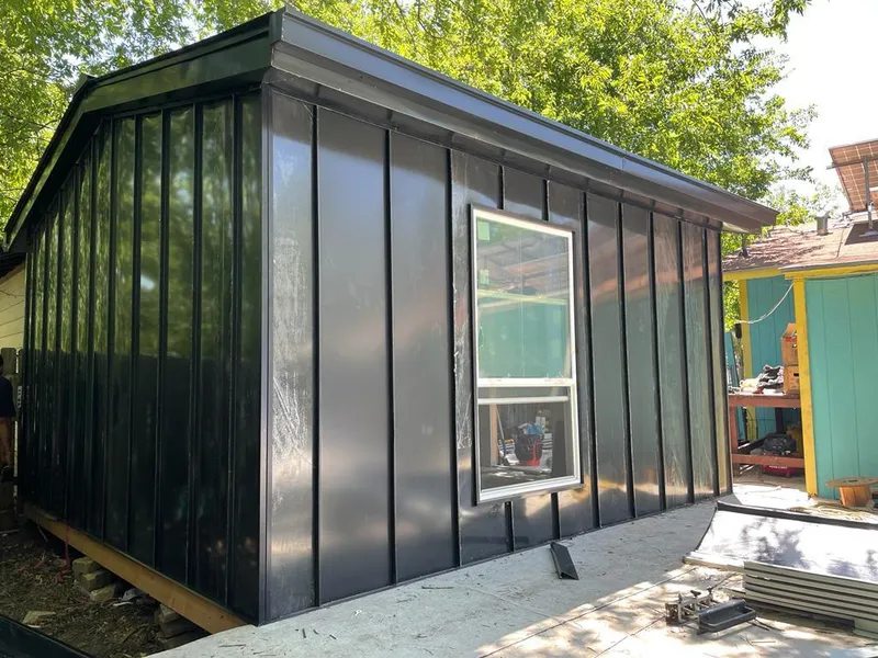 Black standing seam metal wall panels for Roof Inspection in Conley